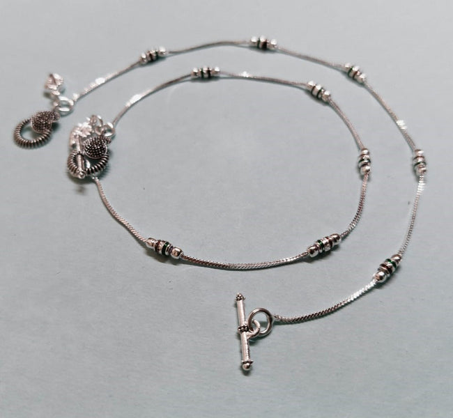 VIBRANT VEILS Oxidised Silver Designer Anklet with Intricate Charm