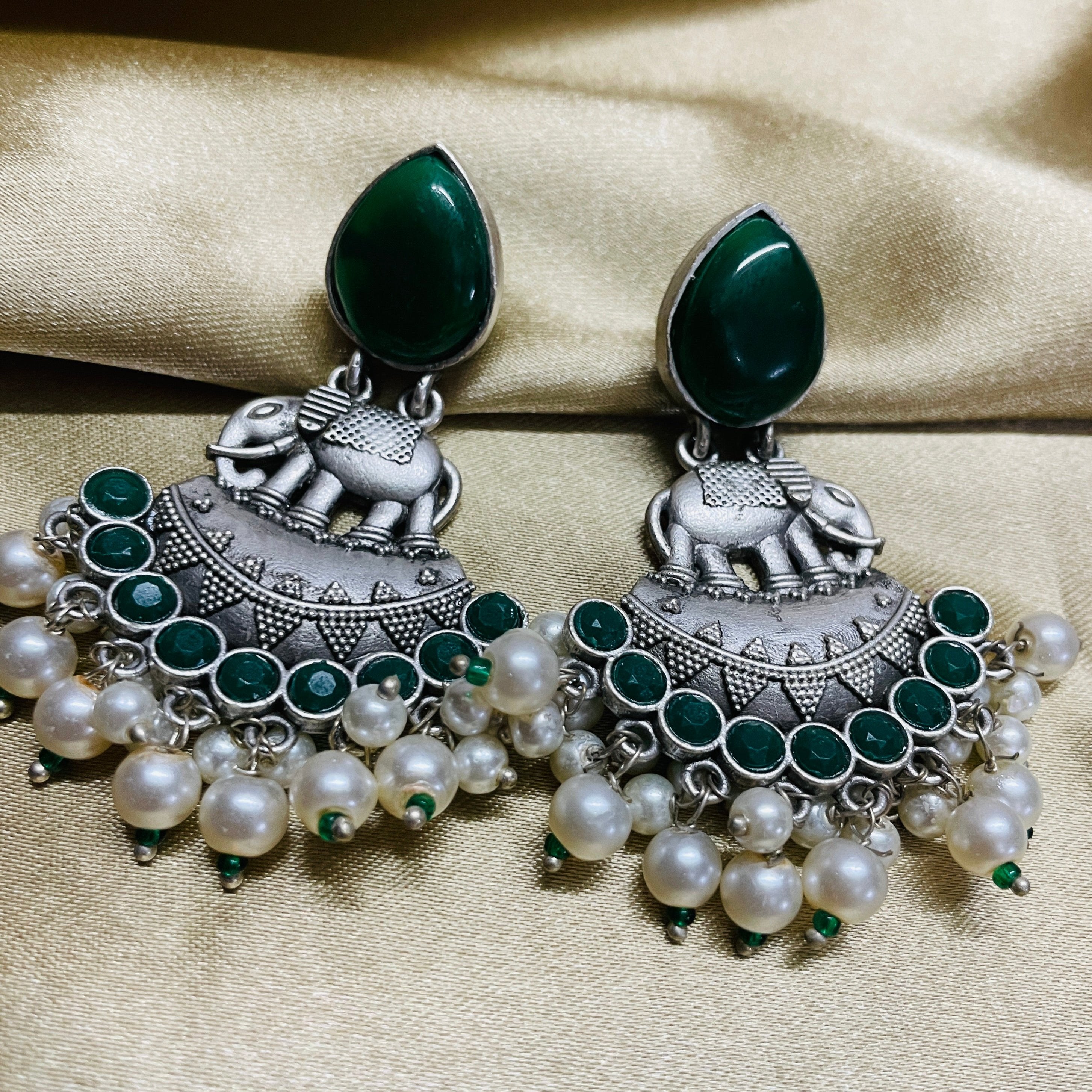 Vibrant Veils Elephant-shaped charm, A cluster of green beads and white pearls dangling Earing