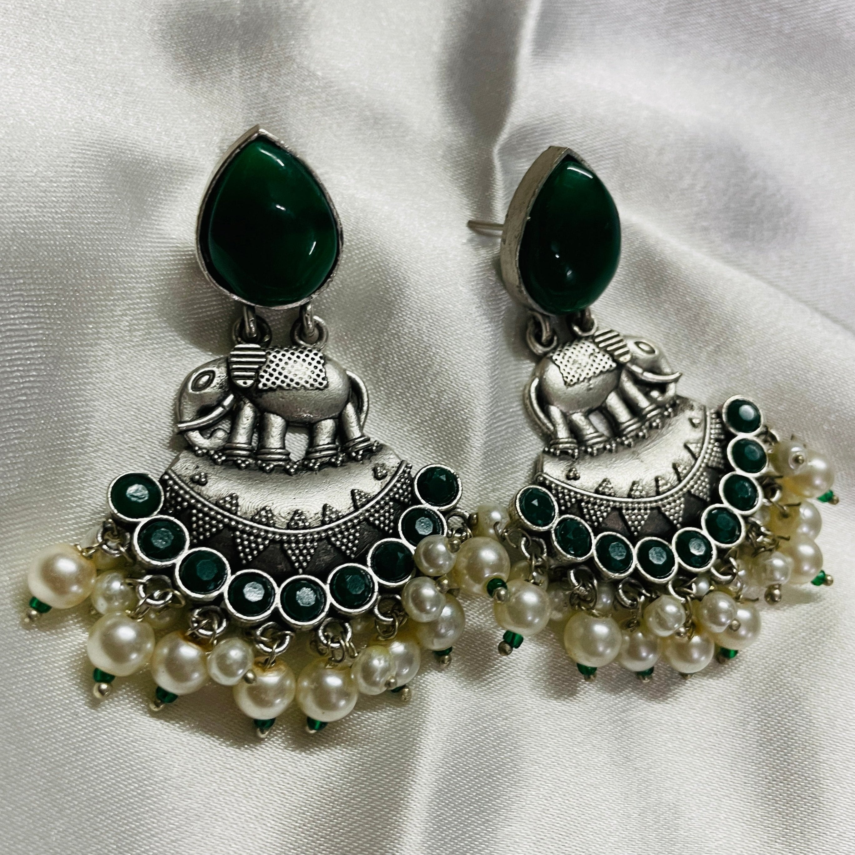 Vibrant Veils Elephant-shaped charm, A cluster of green beads and white pearls dangling Earing