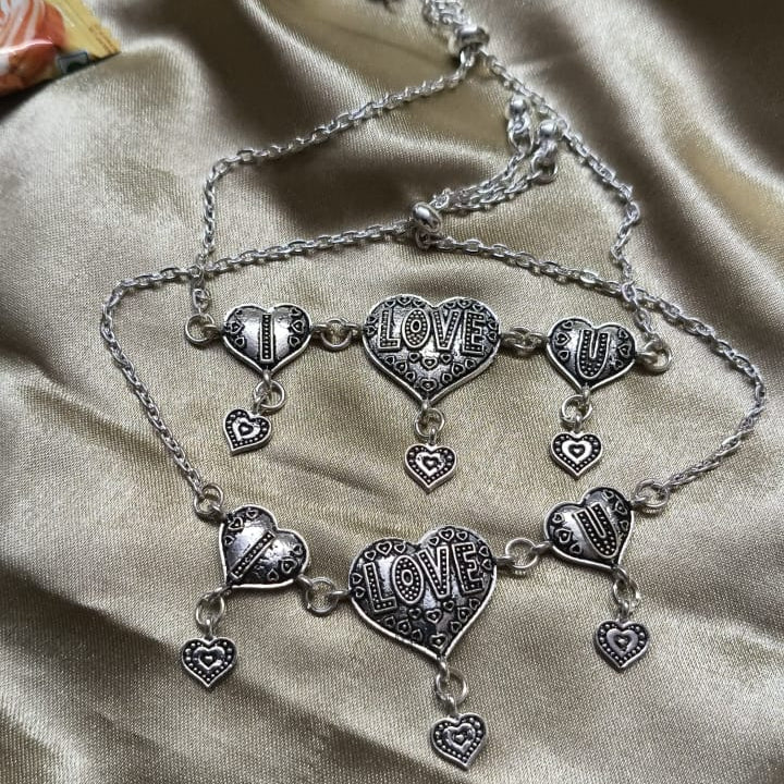 Vibrant Veils Triple Heart Harmony Bracelet