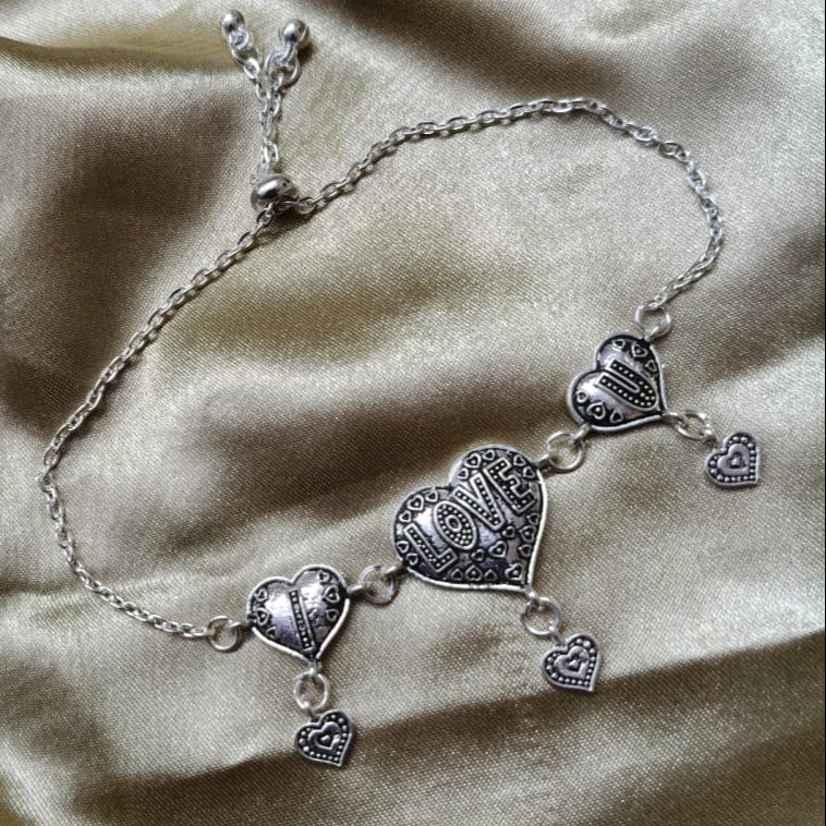 Vibrant Veils Triple Heart Harmony Bracelet