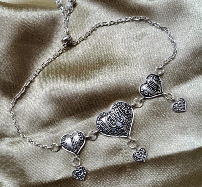 Vibrant Veils Triple Heart Harmony Bracelet