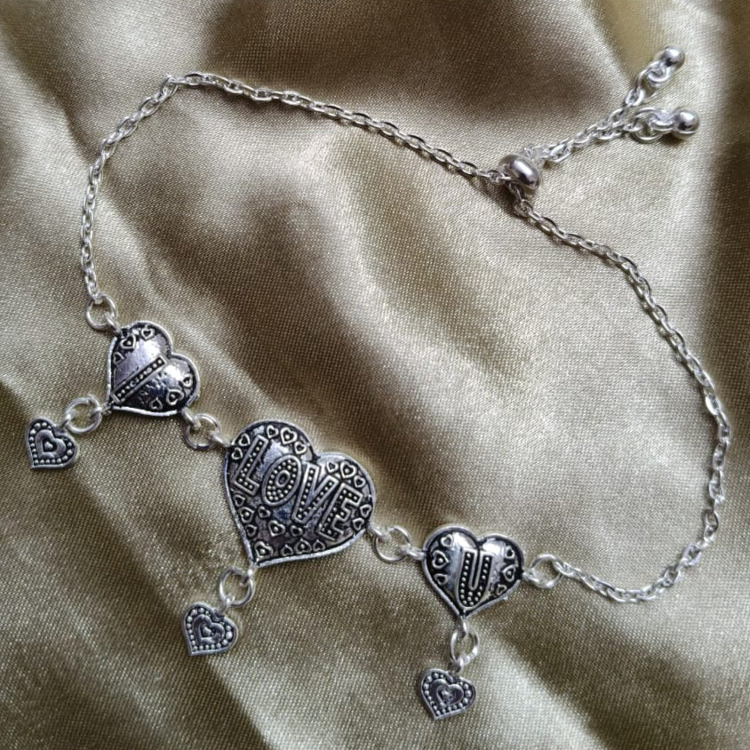 Vibrant Veils Triple Heart Harmony Bracelet